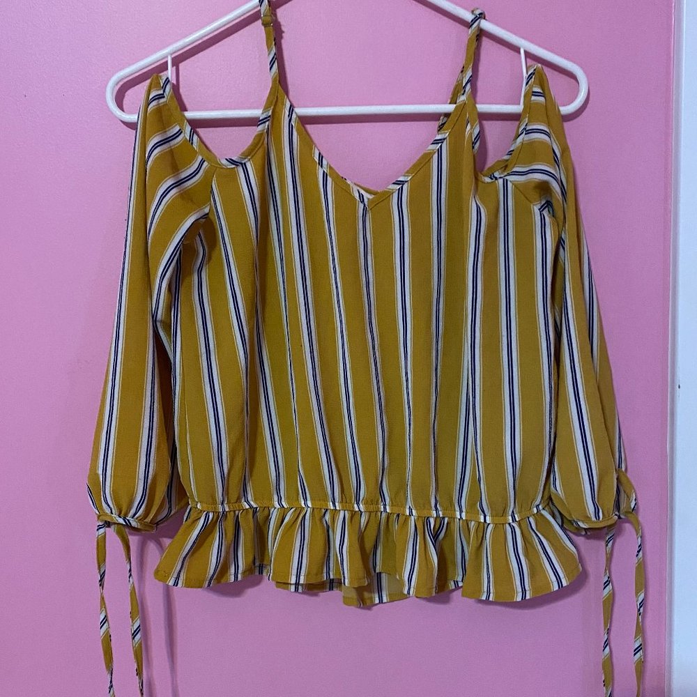Yellow blouse with white and black stripes
